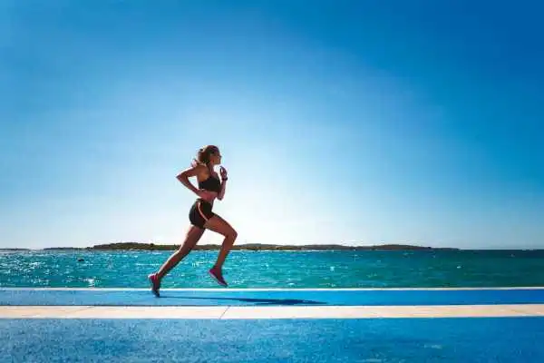 Woman running showing strong leg muscle Dorking